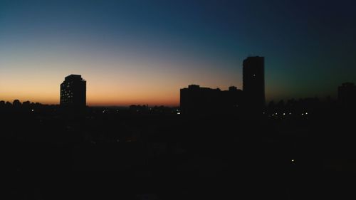 Silhouette of city at night