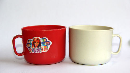 Close-up of tea cup and coffee on table