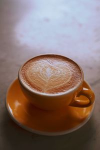 Close-up of cappuccino on table