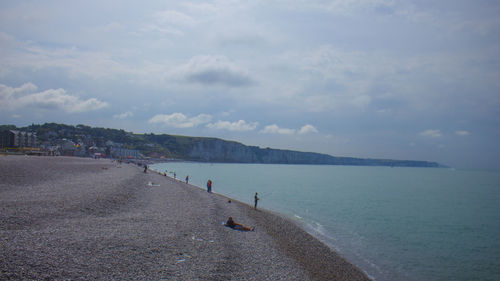 Scenic view of sea against cloudy sky