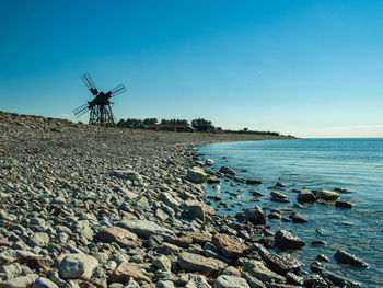 Scenic view of a mill against sky