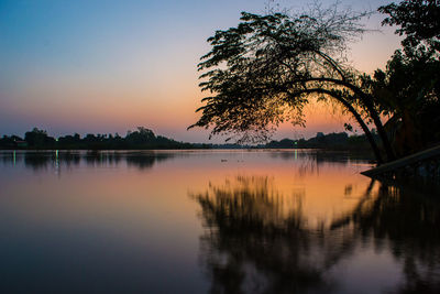 Scenic view of lake against sky during sunset