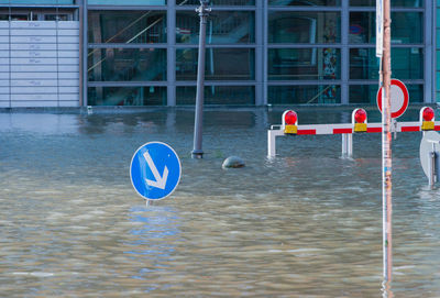 Road sign by sea