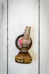 High angle view of old glass container on table