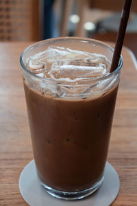 Close-up of coffee in glass on table