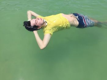 High angle portrait of woman in sea