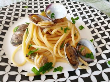 High angle view of pasta in plate on table