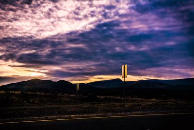 Scenic view of mountains against cloudy sky