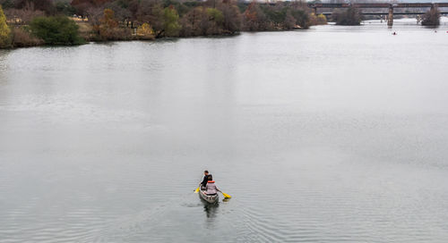 People on boat in river