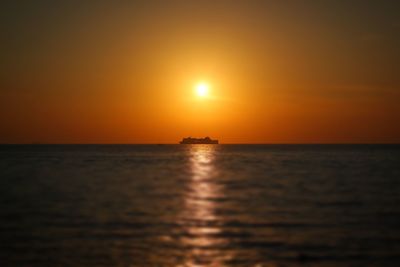 Scenic view of sea against clear sky during sunset