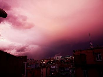 High angle view of buildings against sky during sunset