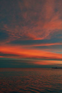 Scenic view of sea against orange sky