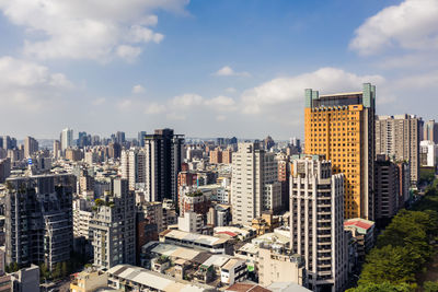 Modern buildings in city against sky