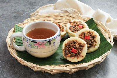 Kue talam oncom, traditional steamed cup cake from indonesia with oncom topping