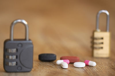 Close-up of padlock on yellow background