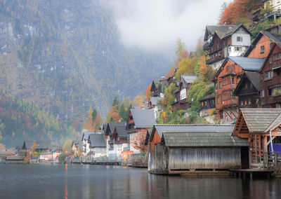 Houses by lake in town