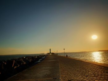 Scenic view of sea against clear sky during sunset