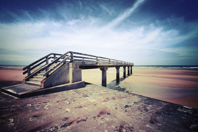 Pier over sea against sky