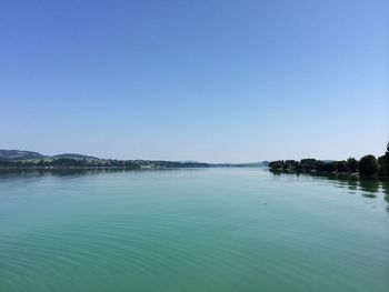 Scenic view of calm sea against clear sky