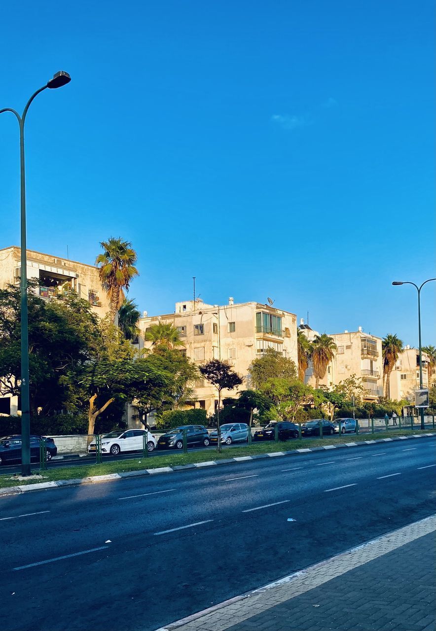 CITY STREET AGAINST CLEAR BLUE SKY