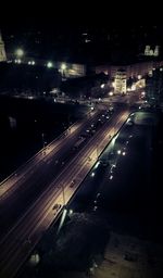 View of illuminated road at night