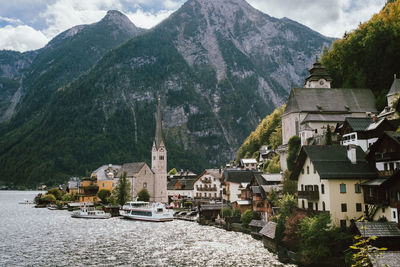 Panoramic view of buildings and mountains against sky