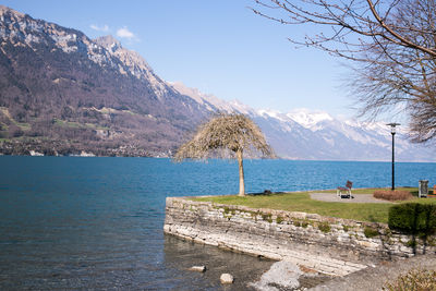 Scenic view of lake and mountains against sky