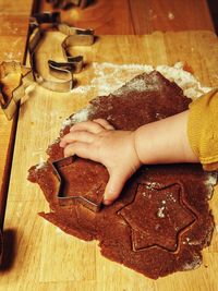 High angle view of woman preparing food on table