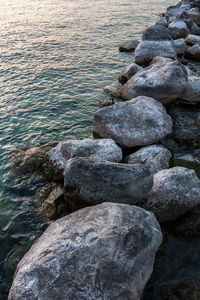 Stones on rocks at shore