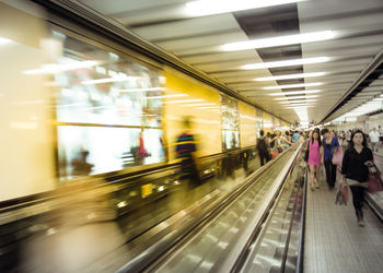 Blurred motion of train at railroad station