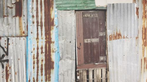 Closed door of old abandoned building