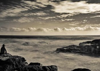 Scenic view of sea against sky at sunset