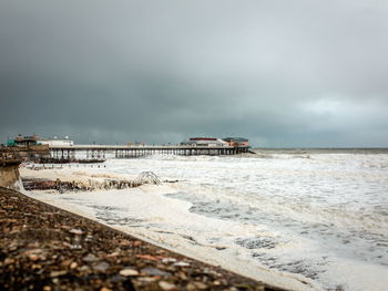 Scenic view of sea against cloudy sky