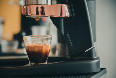 Close-up of coffee in glass on table