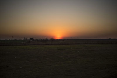 Scenic view of landscape against sky during sunset