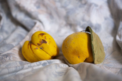 Close-up of yellow fruits on bed