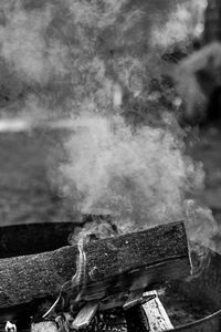 Close-up of smoke emitting from log