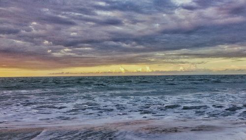 Scenic view of dramatic sky over beach