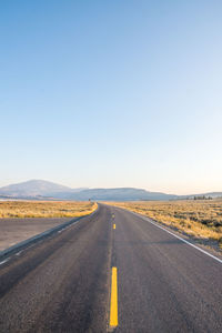 Road on landscape against clear sky