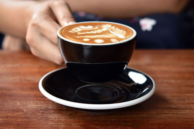 Close-up of coffee cup on table