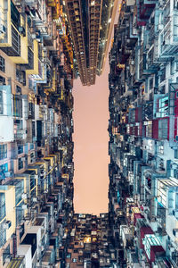 Full frame shot of illuminated cityscape against sky at night