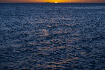 Scenic view of sea against sky at sunset