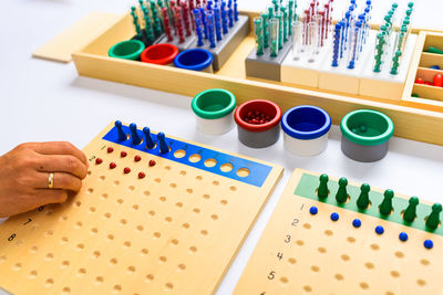 Cropped hand of person working on table