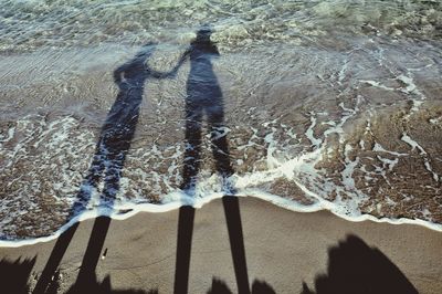 Shadow of people on sand