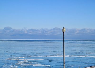 Scenic view of sea against blue sky