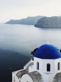 Scenic view of sea and buildings against sky