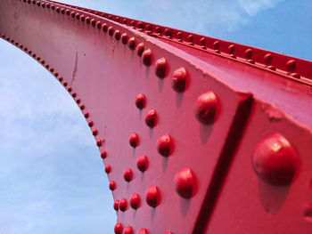 Low angle view of metallic structure against sky