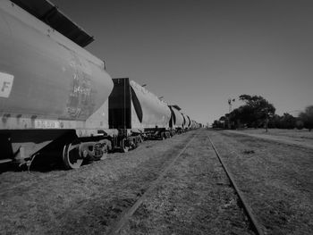 Train on railroad track against clear sky