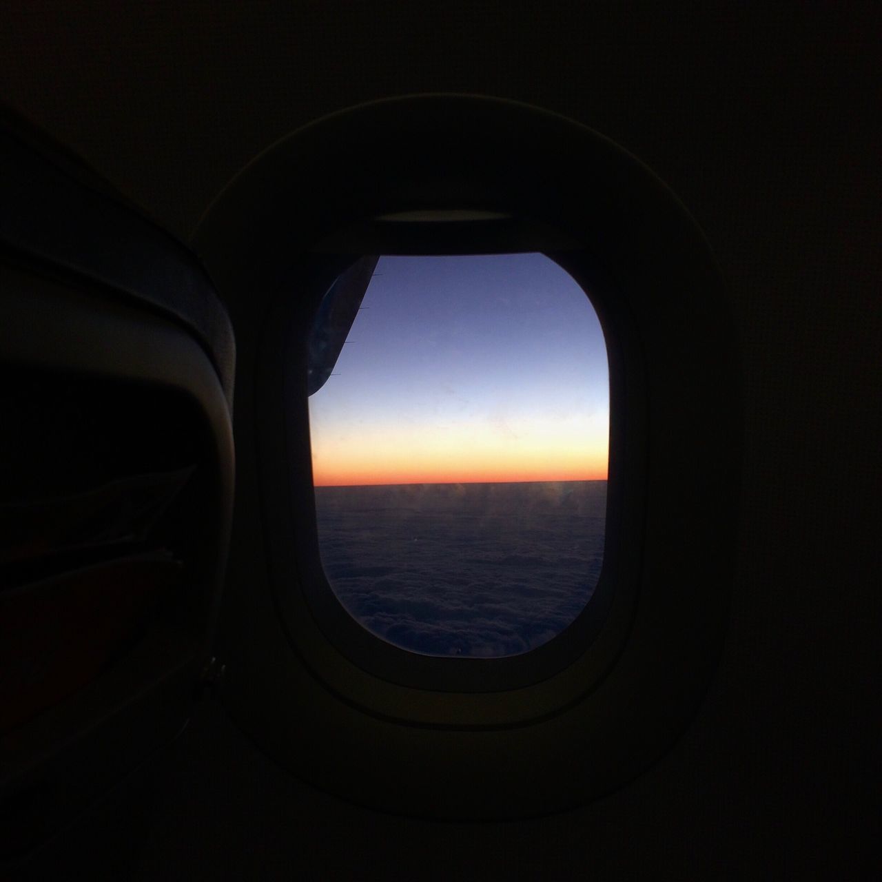 CLOSE-UP OF AIRPLANE WINDOW