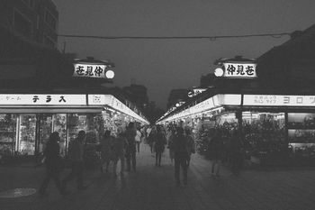 Crowded outdoor market at night